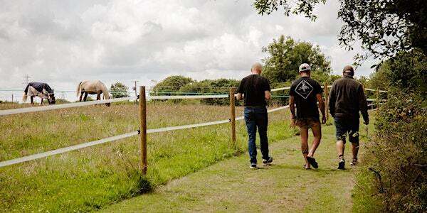 Long shot of the VFV team in fields, getting ready for the veterans family fun day.