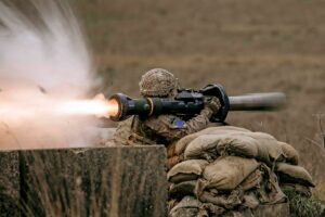 Soldier firing large weapon which can lead to hearing damage